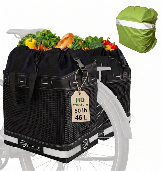 OutWurx 2-pack grocery panniers loaded with produce on a bike rack, shown with the included reflective rain cover, HD structure rated 50 pounds and 46 liters